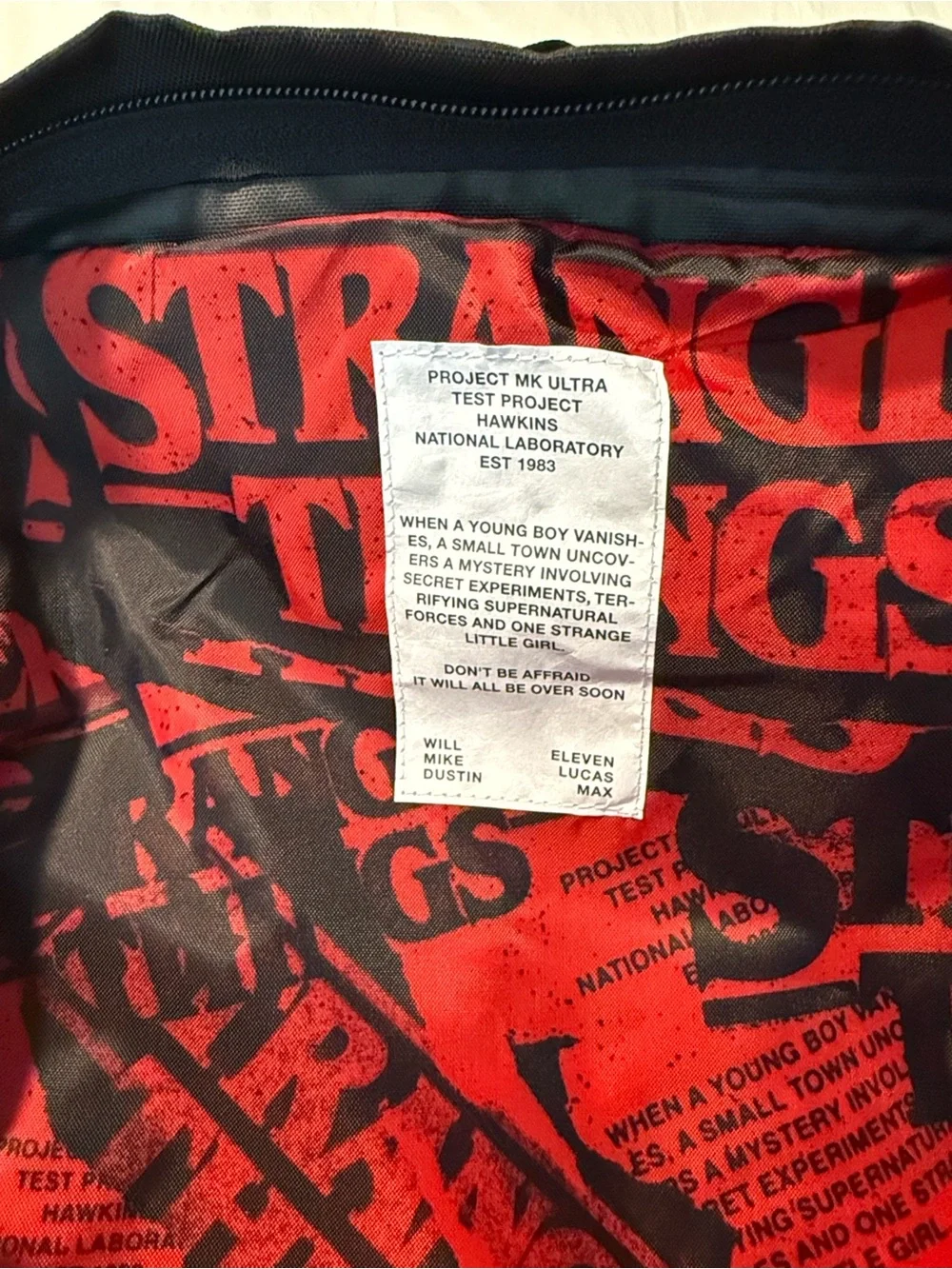 Jansport Black Backpack with Brown Base and Red Logo